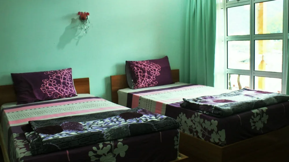 Room with two single beds